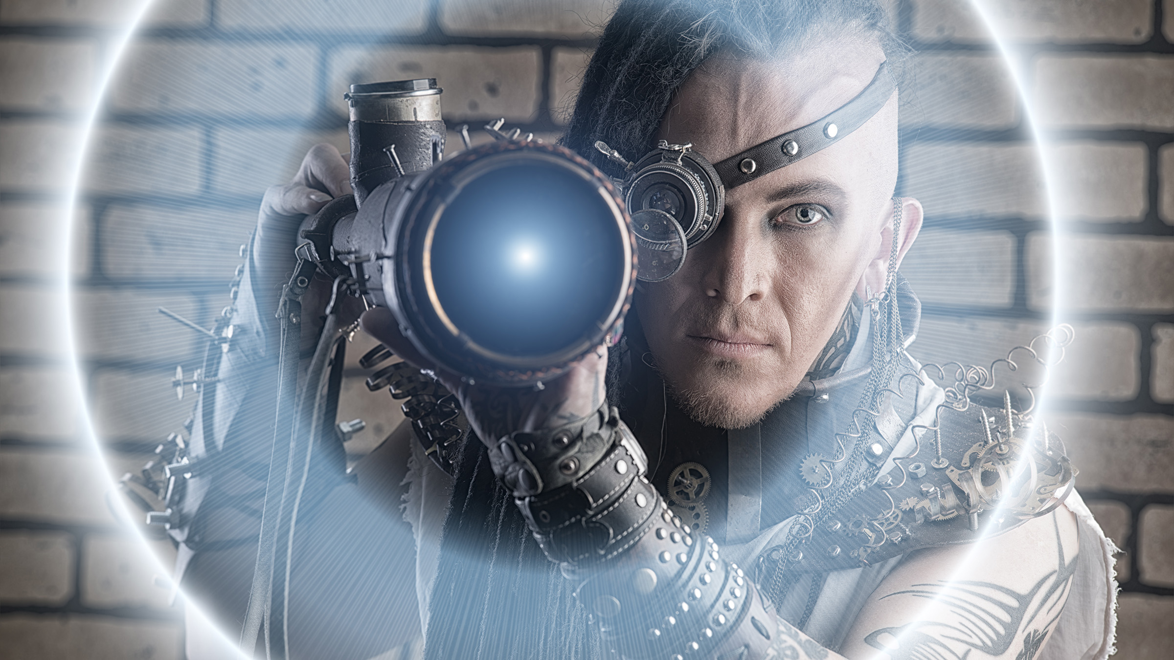 Portrait of a steampunk man with a mechanical devices over brick wall.